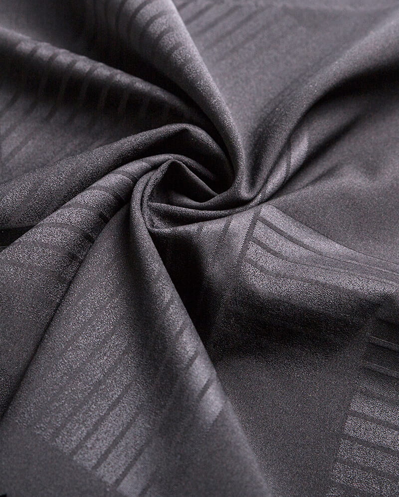 Двусторонняя жаккардовая эластичная ткань.